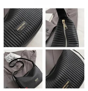 Detailed views of a black pleated crossbody bag with premium gold-tone logo and zipper