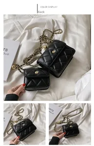 Close-up of diamond quilted texture and golden camellia buckle on black leather chain bag