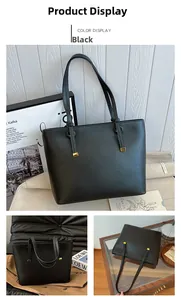 Détail du sac cabas en cuir noir grainé avec d'élégants détails en métal doré carrés