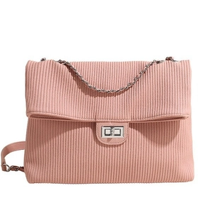 Pink pleated vertical texture shoulder bag with silver twist lock and chain strap