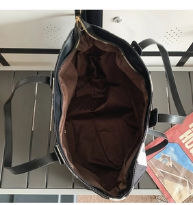 Top view of large canvas tote bag showing spacious interior with brown lining and zipper