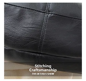 Close-up of precise stitching craft on black pebbled leather texture of tote bag