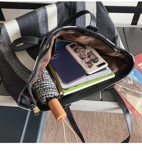 Internal view of large capacity striped tote bag showing space for tablet and daily items