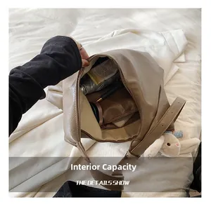Spacious interior of brown hobo bag showing large storage capacity for daily essentials