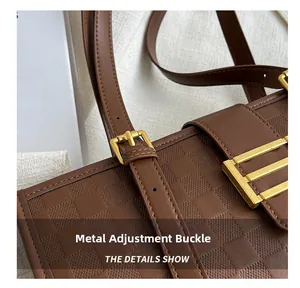 Macro shot of golden hardware buckle and checkered textured leather on brown tote bag