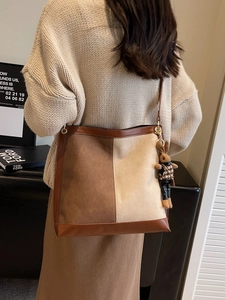 Large capacity color-block bucket bag with a cute plush rabbit pendant charm