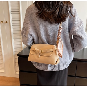 Chic beige lychee leather crossbody bag with decorative heart print silk scarf on strap
