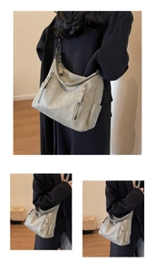 Detail view of large gray PU tote bag with metal zipper compartment and minimalist style