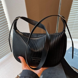 Black pleated crescent shoulder bag with a fashion logo and sleek leather texture