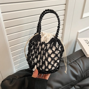 Handmade hollow woven beach bag with black mesh net and white drawstring inner pouch