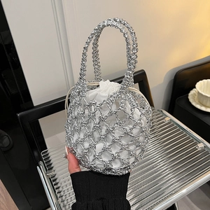 Chic silver hollow woven handbag with white drawstring inner pouch for resort beach fashion