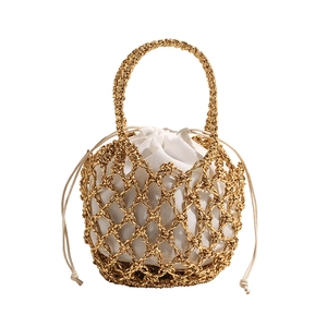Golden woven hollow mesh shoulder bag with tassels and white cotton inner drawstring pouch