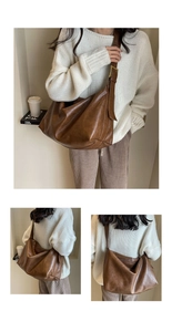 Detailweergave van grote donkerbruine kunstlederen tote met vintage textuur en riem