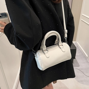 Cream pleated cylinder bag for women with dual top handles and detachable crossbody strap