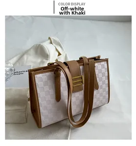Chic checkered tote bag in off-white and khaki shown with stylish urban attire