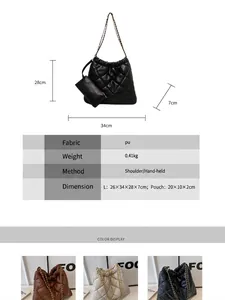 Quilted black tote bag with chain strap and matching small pouch in minimalist style