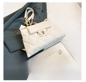 Detailed comparison of white quilted chain tote bag size with a tablet and phone