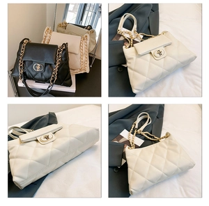 Detail view of quilted leather tote bag with gold chain strap and twist-lock closure