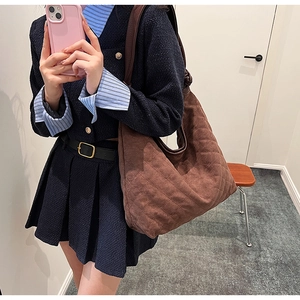 Brown quilted suede hobo bag shown in an OOTD mirror selfie for daily commute styling