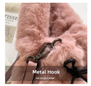 Detail of pink faux fur bag with metallic hardware ring and pink leather strap