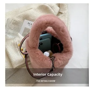 Detail showing the inner capacity of pink plush bucket bag with phone and sunglasses