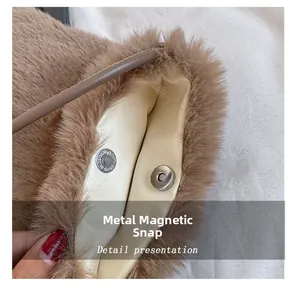 Detail shot of the metal magnetic clasp on a brown plush crossbody bag for women
