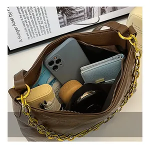 Top macro view showing spacious interior capacity of the brown faux leather crossbody bag