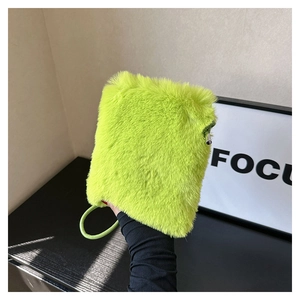Detail of neon green plush phone bag with metal zipper and matching wrist ring