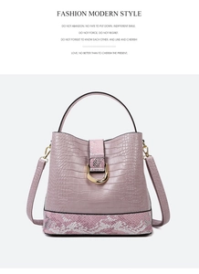 Detailed view of light purple bucket bag with crocodile and snake skin embossed textures