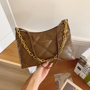 Brown quilted leather shoulder bag with gold chain and Sunita & Fashion lettering