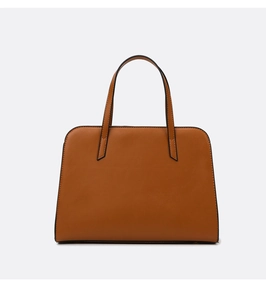 Detail of a brown leather tote bag with black edge painting and dual handles on plain background