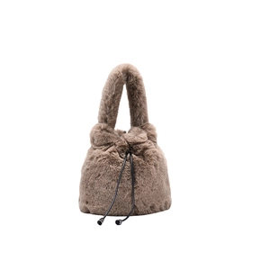 Plush brown faux fur bucket bag with drawstring closure and top handle for winter style