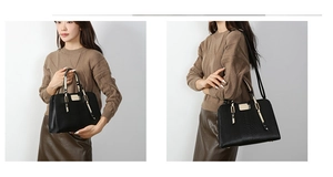 Detail view of black embossed tote bag with black and white snakeskin pattern straps