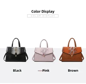 Close-up of three crossbody bags in black, pink, and brown with embossed snakeskin texture