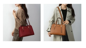 Detail of embossed crocodile pattern leather handbags with gold metal hardware and brand plate