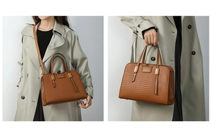 Detail showing caramel brown crocodile embossed texture and metallic brand logo plate