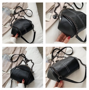 Multiple views showing white cross stitching on black leather bag with metal chain strap