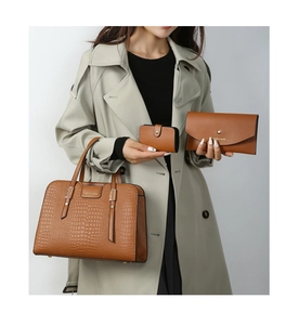 Brown embossed crocodile leather handbag set including tote, wallet, and card holder