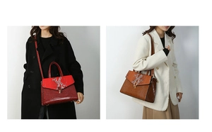 Detail view of burgundy and tan crocodile pattern handbags with silver branch hardware