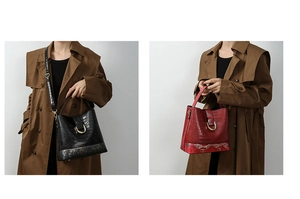 Detail of burgundy and black bucket bags with crocodile pattern and gold buckle