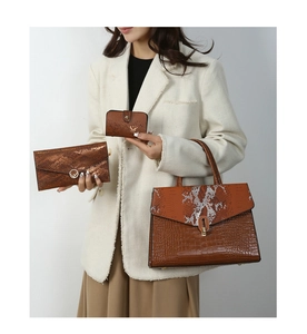 Brown composite leather three-piece set with embossed texture and gold metal accents