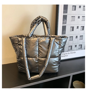 Close-up of quilted down tote bag in silver grey nylon with detachable shoulder strap