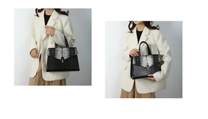 Dettaglio elegante borsa a mano motivo coccodrillo con patta a serpente su un blazer