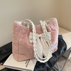 Pink plush tote bag with white lace bow and woven handles for winter style