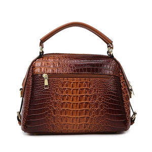 Brown crocodile embossed handbag with smooth top handles and metal crossbody hardware