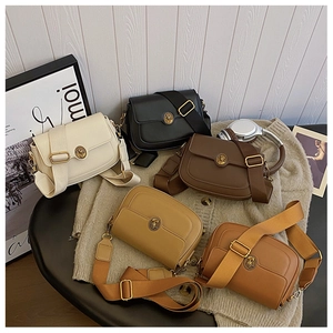 Detailed flat lay of vintage crossbody square bags in five colors with wide woven straps