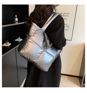 Silver quilted down tote bag detail shown on model back for autumn winter style