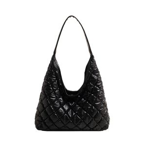 Chic black quilted tote bag with glossy finish and stylish diamond stitching pattern