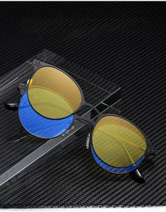 Detail of cat-eye metal frame glasses showing hinge stars and lens specs