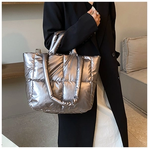 Silver metallic quilted puffer tote bag for women showing a stylish large capacity design